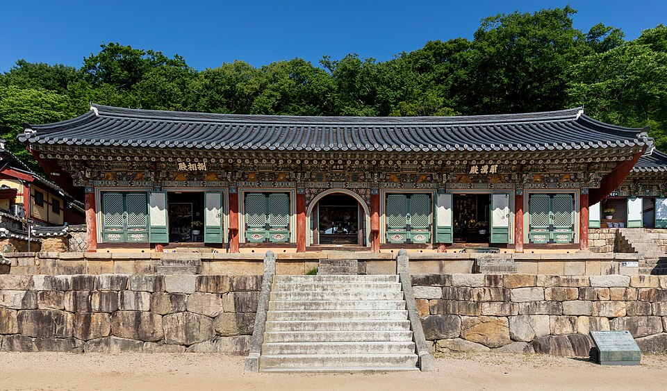 Front exterior view of Beomeosa temple with stairs and blue sky in Busan South Korea