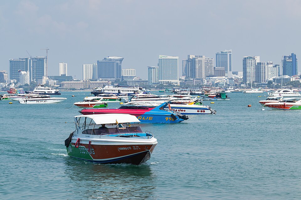 Boat moving towards a pier in Pattaya, Thailand
