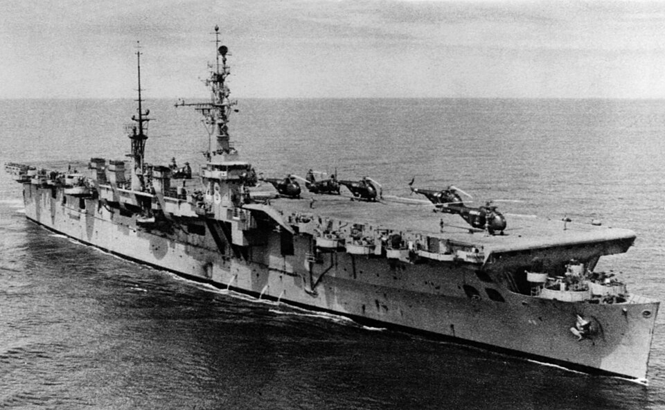 USS Saipan (CVL 48) at sea with helicopters embarked, circa in 1955 (NH 67747)